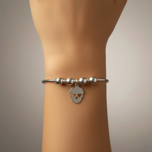 Closeup of Skull charm sterling silver hand-made women's stacking bracelet by My Silver Wish