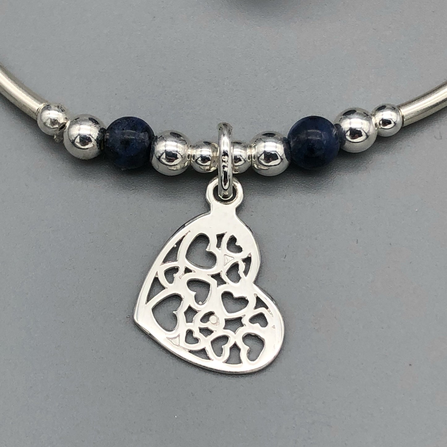 Closeup of Heart charm filigree sterling silver & sodalite gemstone women's stacking bracelet by My Silver Wish