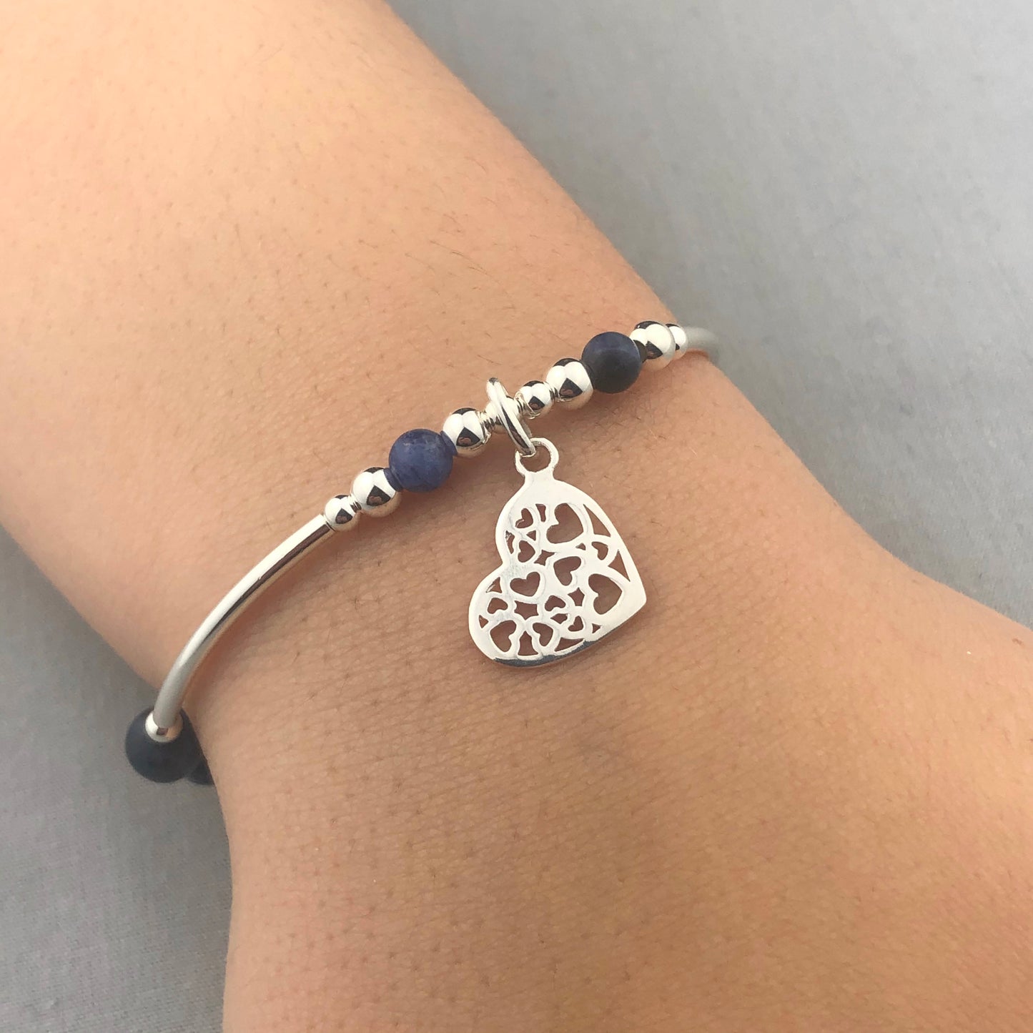 Closeup of heart charm filigree sterling silver & sodalite gemstone women's stacking bracelet by My Silver Wish