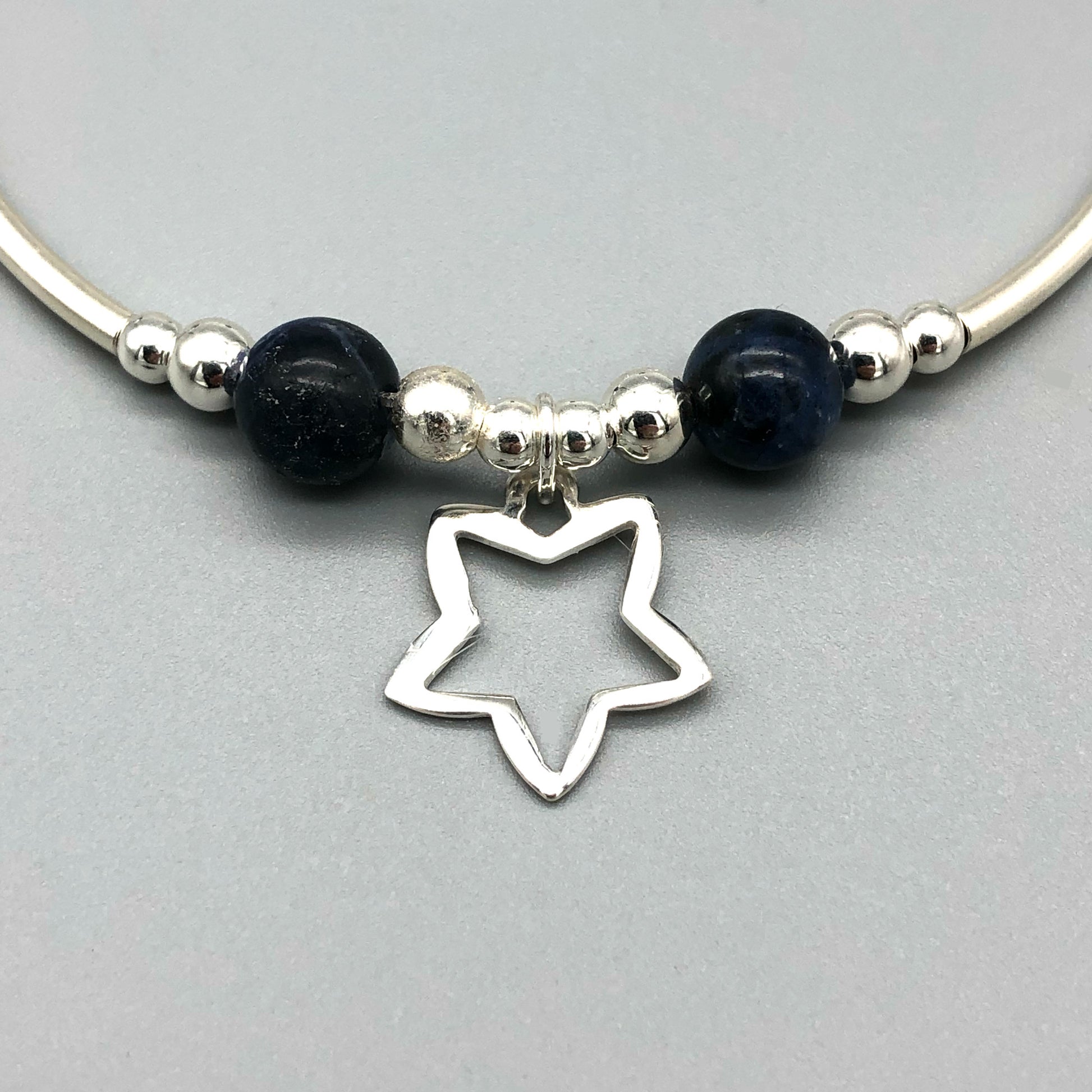 Closeup of Star charm sodalite healing stone &  sterling silver beads women's stacking bracelet by My Silver Wish