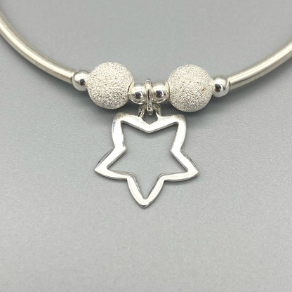 Closeup of Open star charm sterling silver stacking bracelet for her by My Silver Wish