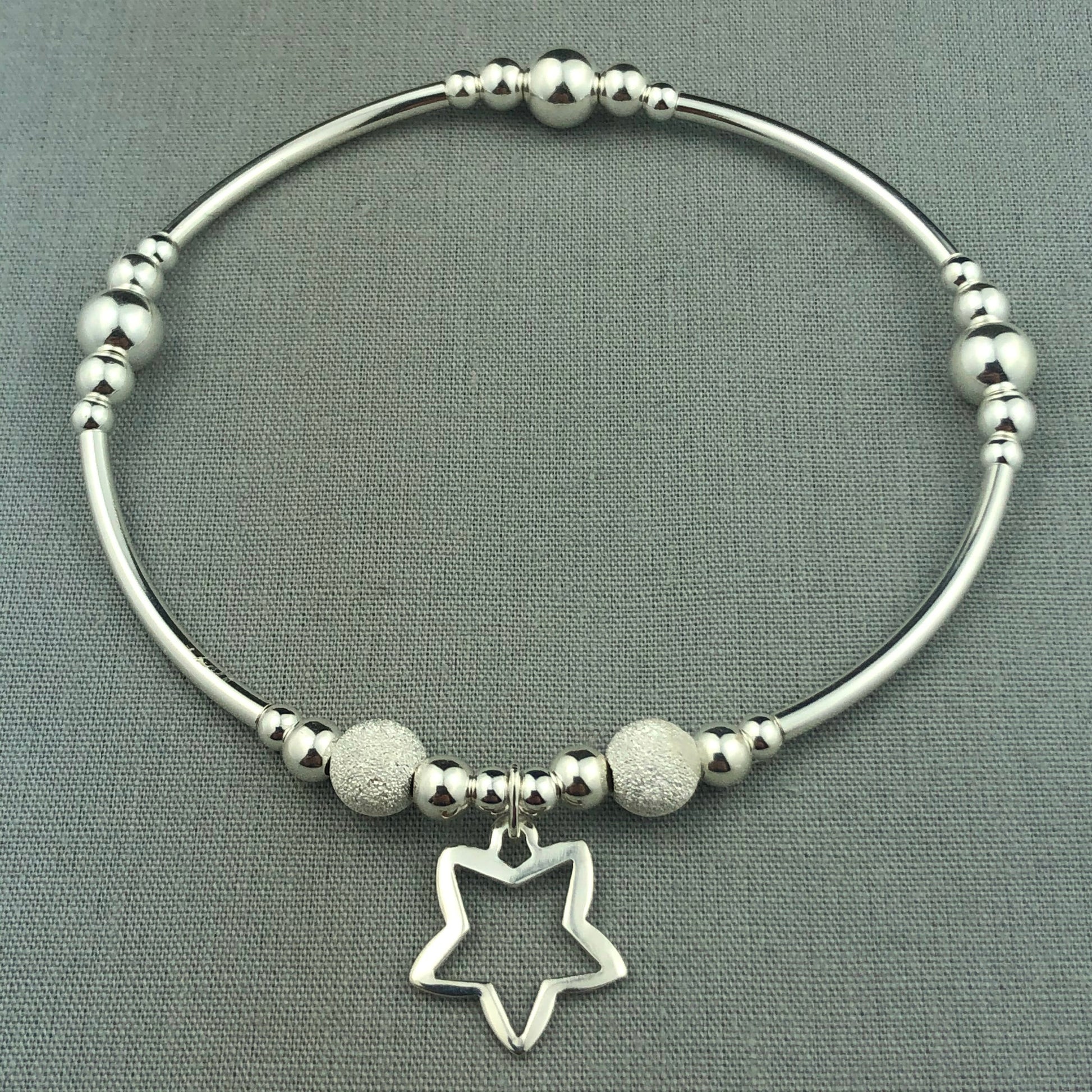 Open star charm women's sterling silver stacking charm bracelet by My Silver Wish