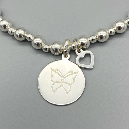 Closeup of "Sister there is no better friend..." with butterfly symbol women's sterling silver stacking bracelet by My Silver Wish