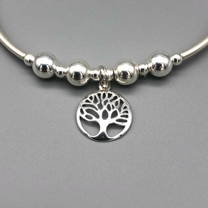 Closeup of Tree of Life charm sterling silver women's hand-made stacking bracelet by My Silver Wish