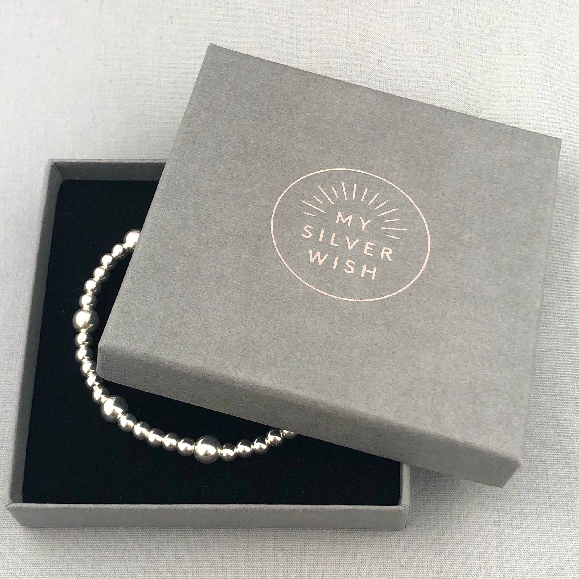 My Silver Wish gift box with stacking charm bracelet inside